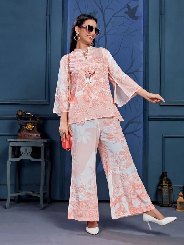 stylish monochromatic floral printed pure viscose natural crepe flare sleeves and mandarin collar neck tie-up drawstrings with tessels top pared with comfortable flare pants set - Peach