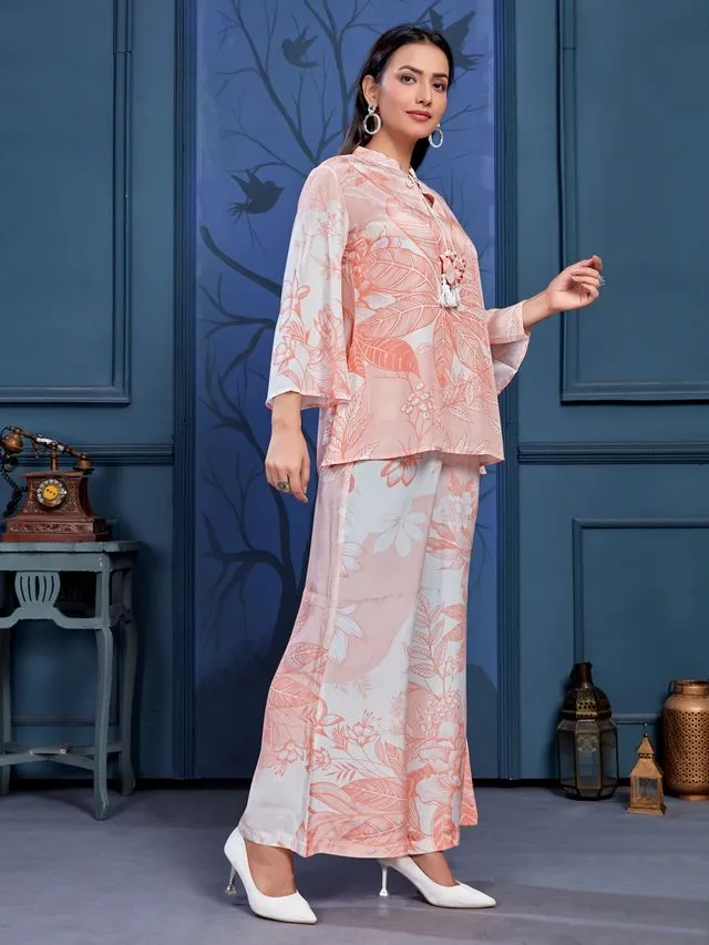 stylish monochromatic floral printed pure viscose natural crepe flare sleeves and mandarin collar neck tie-up drawstrings with tessels top pared with comfortable flare pants set - Peach