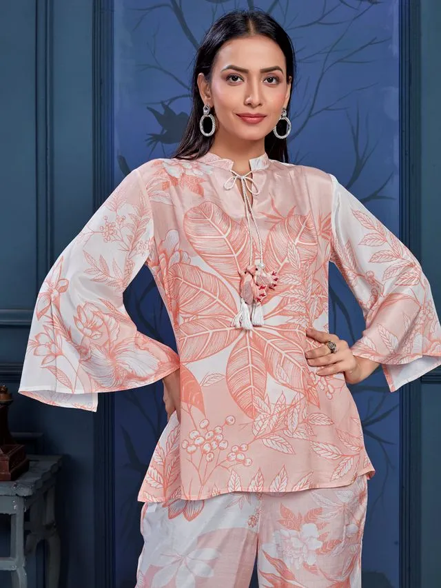 stylish monochromatic floral printed pure viscose natural crepe flare sleeves and mandarin collar neck tie-up drawstrings with tessels top pared with comfortable flare pants set - Peach