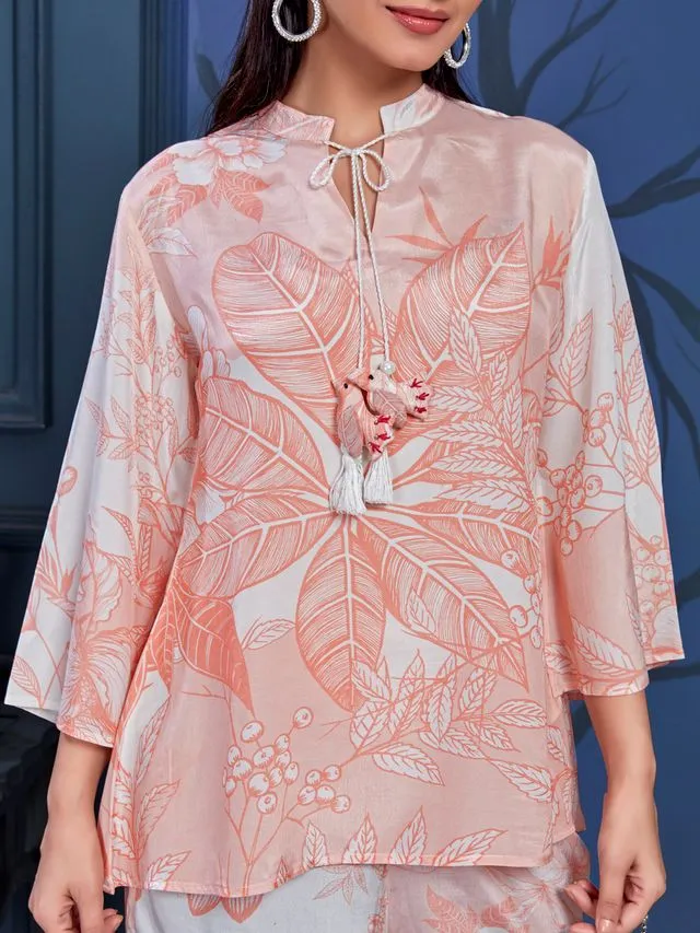 stylish monochromatic floral printed pure viscose natural crepe flare sleeves and mandarin collar neck tie-up drawstrings with tessels top pared with comfortable flare pants set - Peach